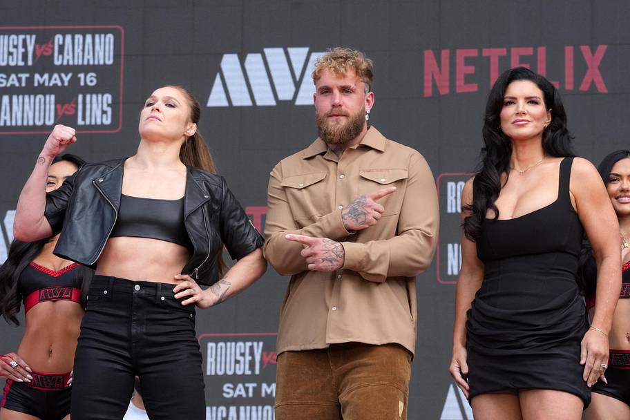 Ronda Rousey (left), Jake Paul (center) and Gina Carano pose at a press conference for their MVP MMA featherweight bout at In