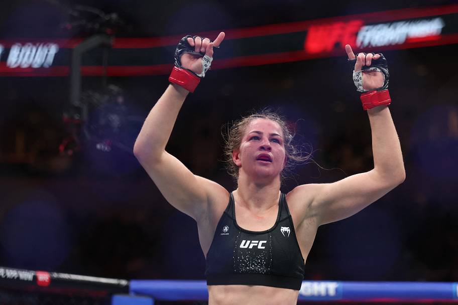 Jasmine Jasudavicius (red gloves) celebrates after the fight against Karine Silva (blue gloves) during UFC Fight Night at Can