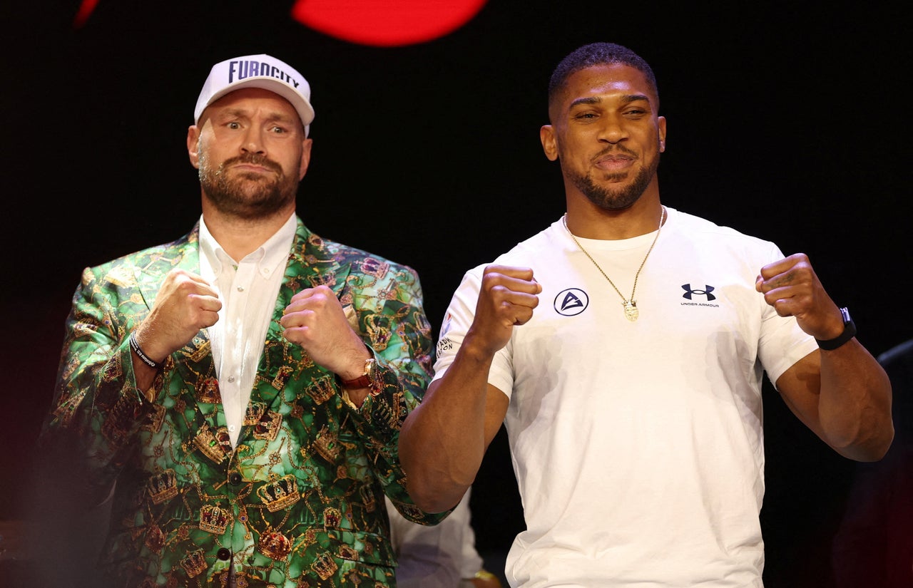 Anthony Joshua (right) and Tyson Fury pose during the press conference (Reuters)