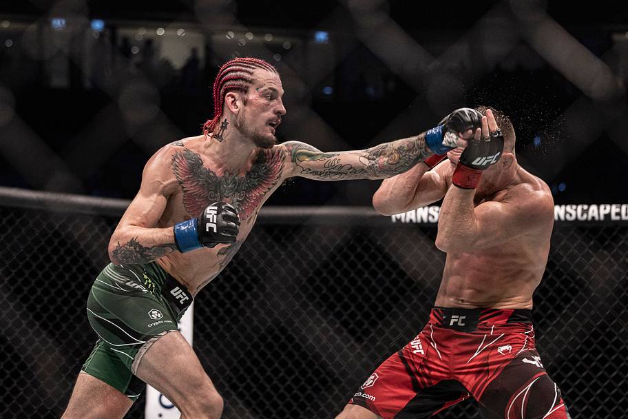 Petr Yan (red gloves) and Sean O'Malley (blue gloves) during UFC 280 at Etihad Arena.