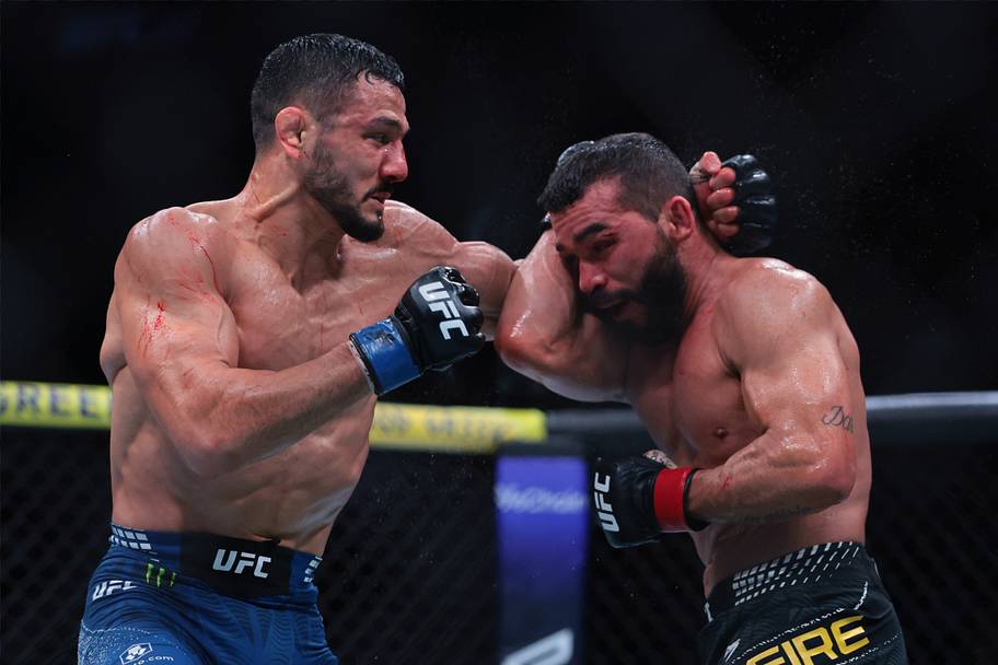 Patricio Pitbull (red gloves) fights Aaron Pico (blue gloves) during UFC 327 at Kaseya Center.