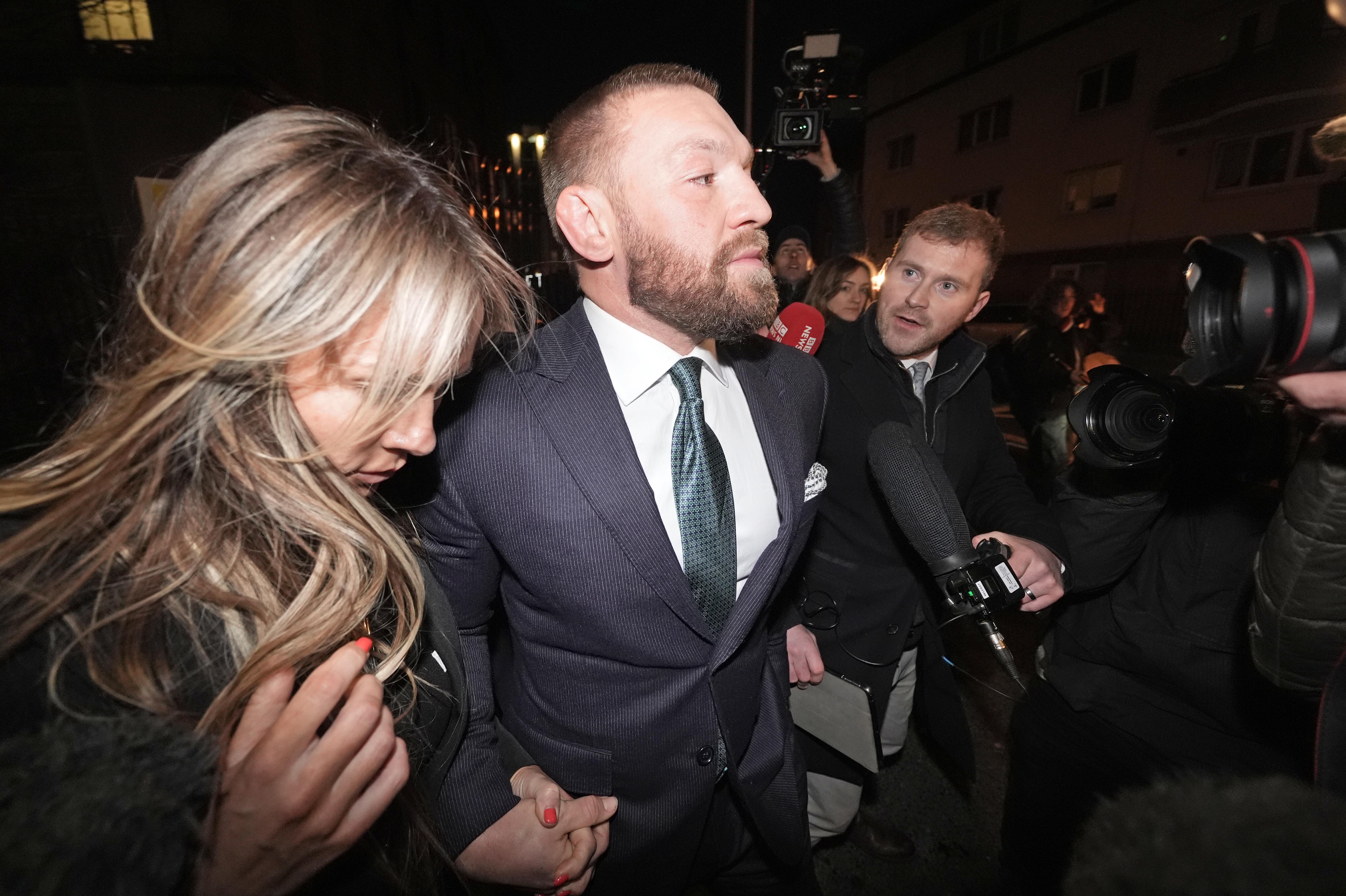 Mixed martial arts fighter Conor McGregor and partner Dee Devlin leave the High Court in Dublin after the personal injury case against him. Nikita Hand, who is also known as Nikita Ni Laimhin, alleges she was raped by McGregor in a Dublin hotel in December 2018. After deliberating for six hours and 10 minutes, the jury returned with their verdicts in the civil trial against Conor McGregor. The total amount of damages awarded to Nikita Hand by the jury was 248,603.60 euro. Picture date: Friday November 22, 2024. (Photo by Brian Lawless/PA Images via Getty Images)