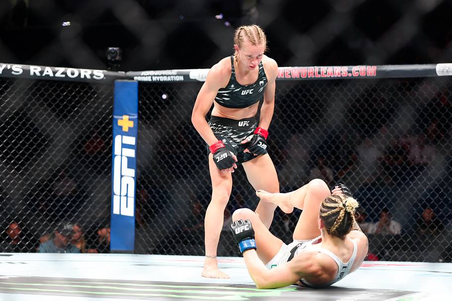 Carli Judice (red gloves) fights against Nicolle Caliari (blue gloves) during UFC 318 at Smoothie King Center.