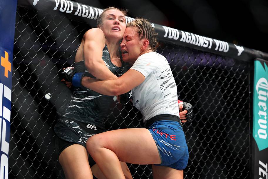Yana Santos (red gloves) fights Miesha Tate (blue gloves) during UFC Fight Night at Wells Fargo Arena.
