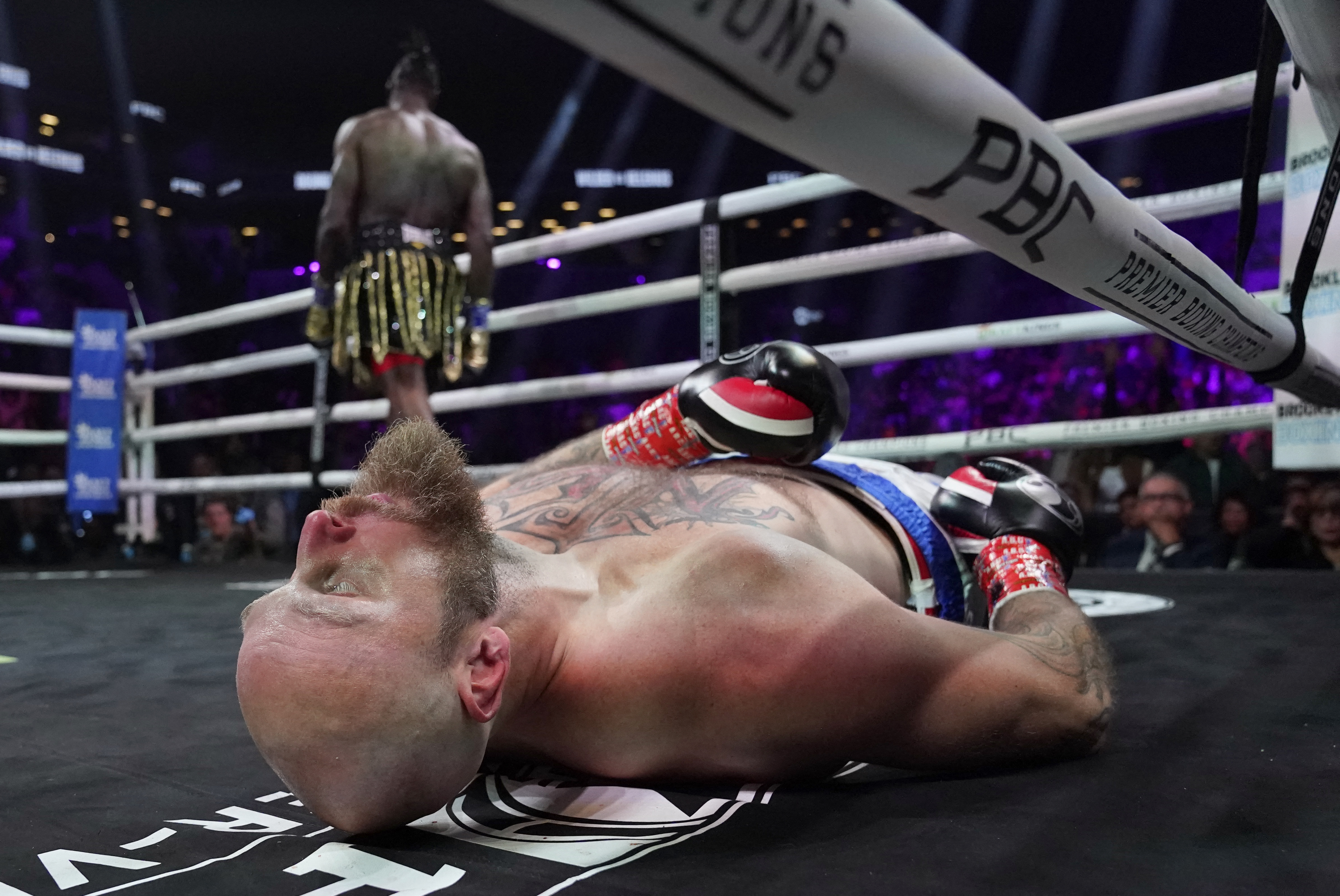 TOPSHOT - US boxer Deontay Wilder (L) knocks out Swedish-Finnish boxer Robert Helenius in the 1st round of their 12-round WBC World Heavyweight Title Eliminator fight at Barclays Center in Brooklyn, New York, on October 15, 2022. (Photo by TIMOTHY A. CLARY / AFP via Getty Images)