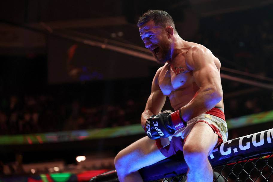 Merab Dvalishvili (red gloves) reacts after defeating Sean O'Malley (not pictured) in a bantamweight title fight during UFC 3