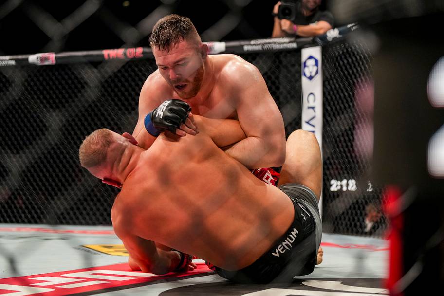 Marcin Tybura (red gloves) fights against Mick Parkin (blue gloves) during UFC Fight Night at O2 Arena.