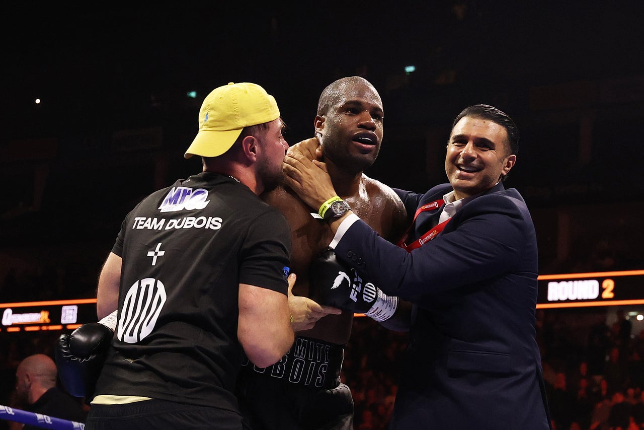 Dubois celebrates with his team after finishing Wardley (Getty)