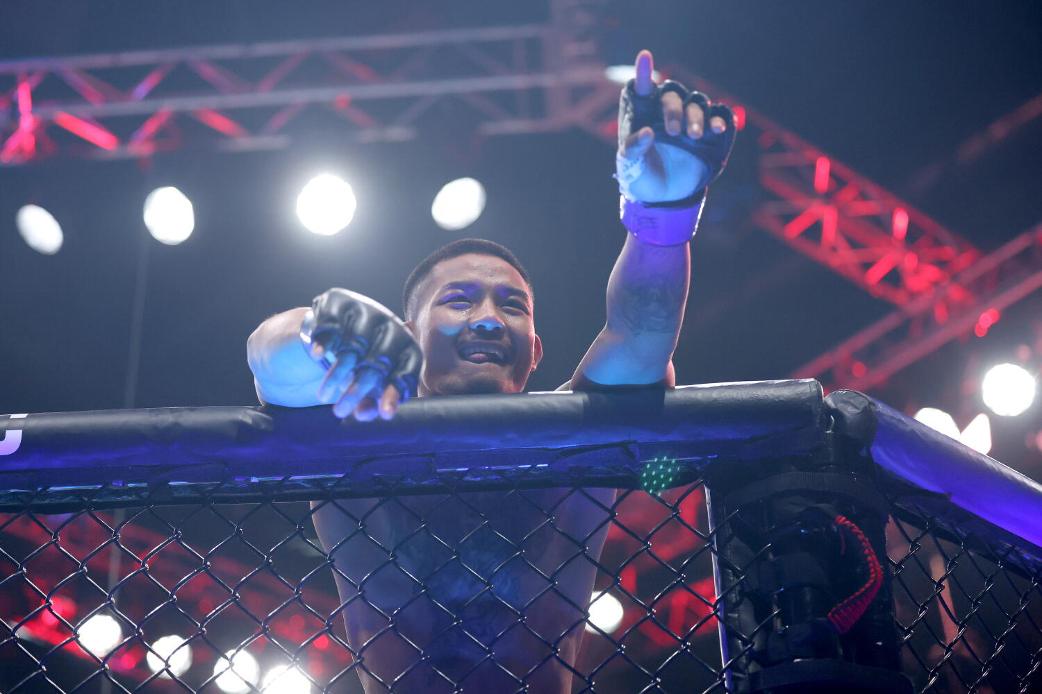 Joshua Van celebrates after defeating Alexandre Pantoja in a flyweight title bout during UFC 323 on Dec. 6 in Las Vegas.