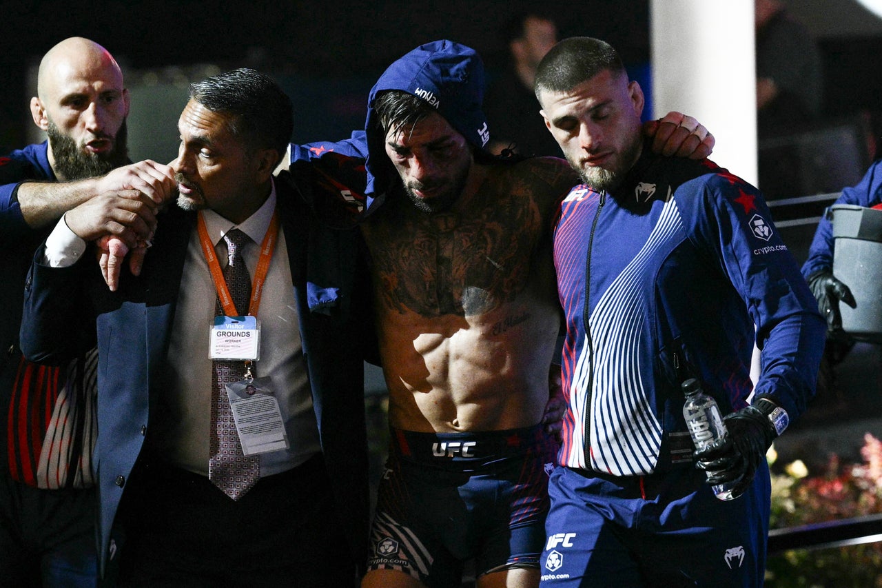 Ilia Topuria (centre) after his defeat by Justin Gaethje at the White House (AFP/Getty)