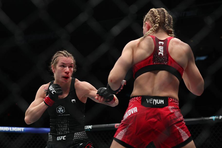 Melissa Croden (red gloves) fights Daria Zheleznyakova (blue gloves) during UFC Fight Night at Canada Life Centre.