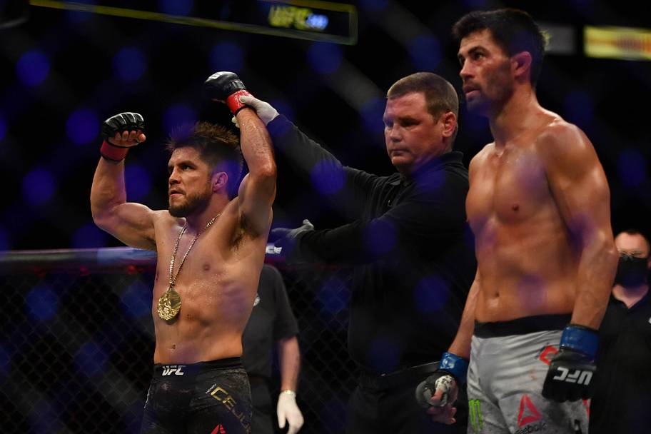 Henry Cejudo (red gloves) celebrates after defeating Dominick Cruz (blue gloves) during UFC 249 at VyStar Veterans Memorial A