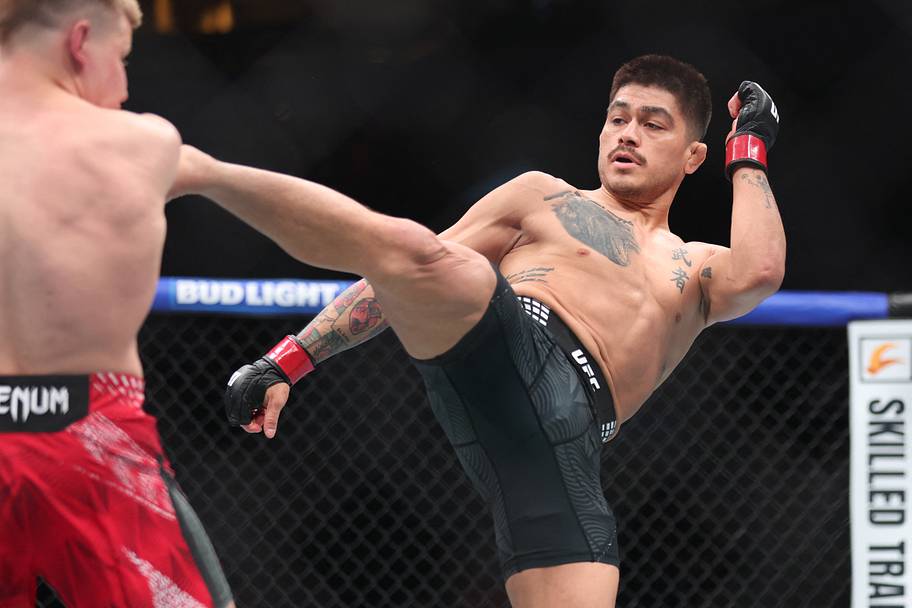 John Castaneda (red gloves) fights Mark Vologdin (blue gloves) during UFC Fight Night at Canada Life Centre.