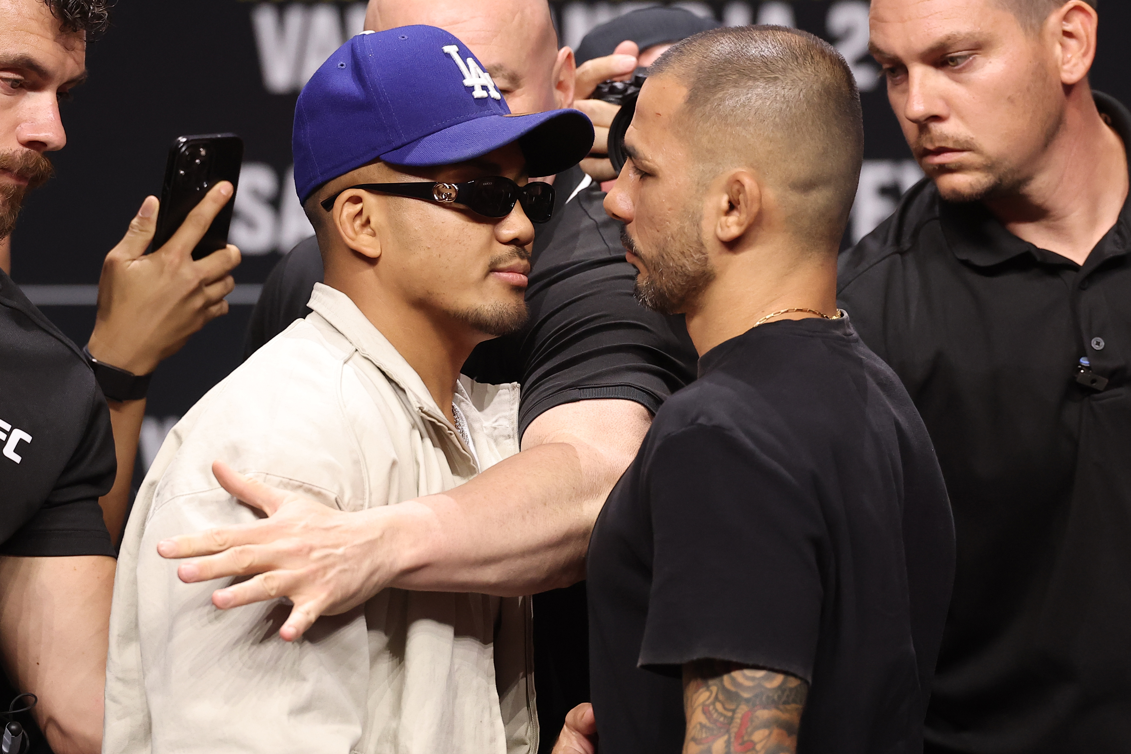 PHILADELPHIA, PENNSYLVANIA - AUGUST 14: (L-R) Opponents Joshua Van of Myanmar and Alexandre Pantoja of Brazil face off during the UFC 331 press conference at Xfinity Mobile Arena on August 14, 2026 in Philadelphia, Pennsylvania. (Photo by Ed Mulholland/Zuffa LLC)