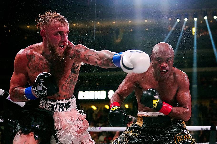 Jake Paul punches Anderson Silva during a bout at Desert Diamond Arena on October 29, 2022.