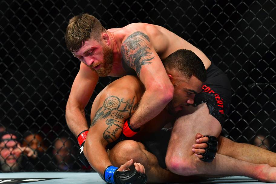 Gerald Meerschaert (red gloves) fights Deron Winn (blue gloves) during UFC 248 at T-Mobile Arena.