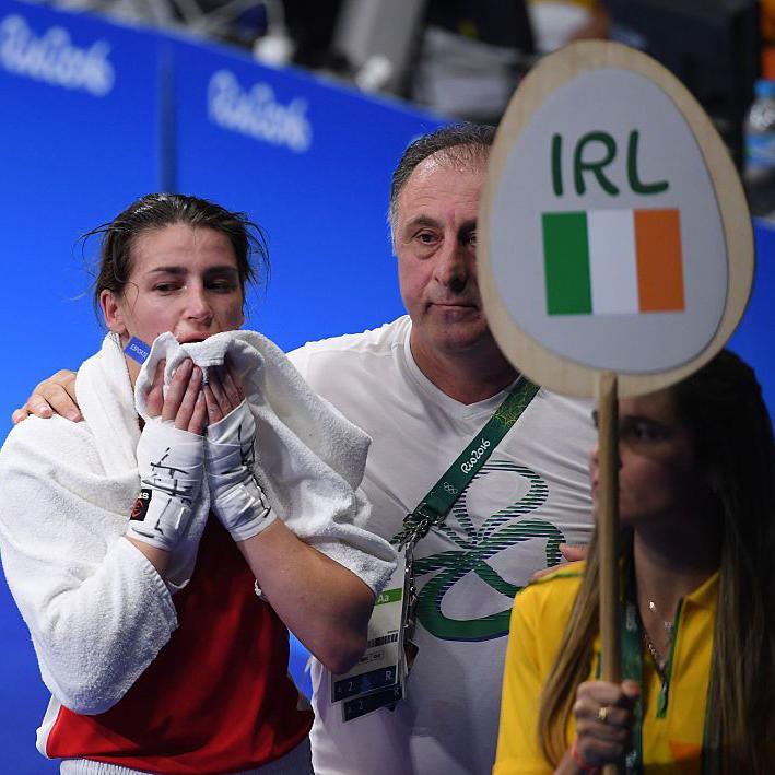 Katie Taylor is consoled by her coach