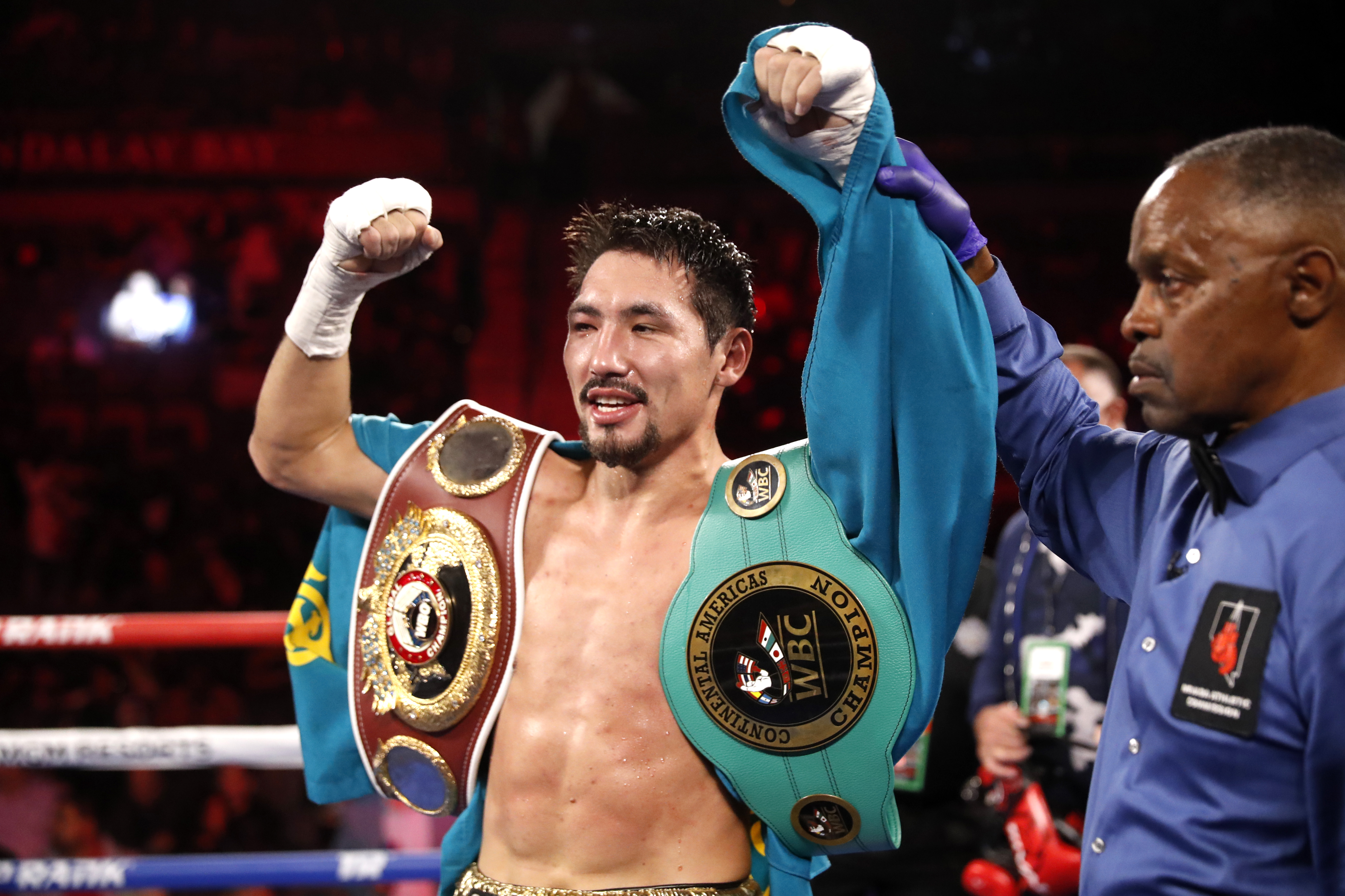 LAS VEGAS, NEVADA - NOVEMBER 20: Janibek Alimkhanuly is declared the winner by referee Kenny Bayless after defeating Hassan N'Dam N'Jikam in a middleweight bout at Michelob ULTRA Arena on November 20, 2021 in Las Vegas, Nevada. Alimkhanuly won the fight with an eighth-round TKO. (Photo by Steve Marcus/Getty Images)