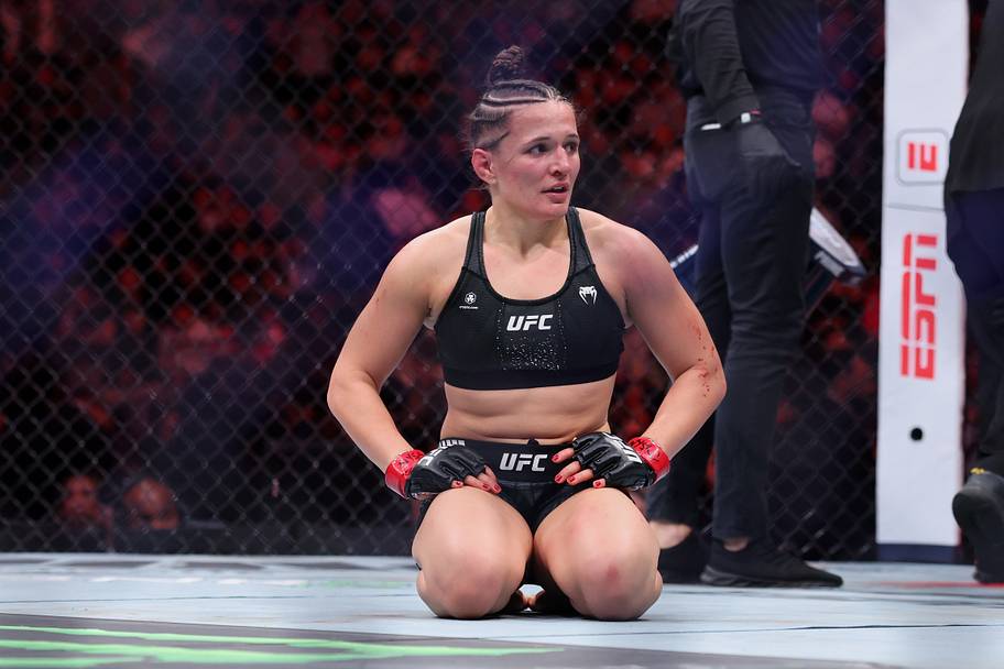Erin Blanchfield (red gloves) reacts after her womens flyweight bout against Tracy Cortez (not pictured) during UFC 322 at Ma