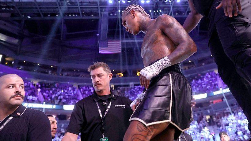 Conor Benn is wearing black shorts as he walks out the ring