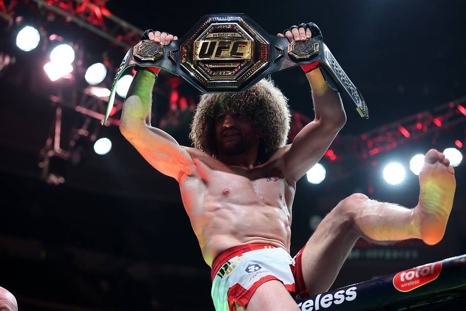 Merab Dvalishvili (red gloves) reacts after defeating Sean O'Malley (not pictured) in a bantamweight title fight during UFC 3