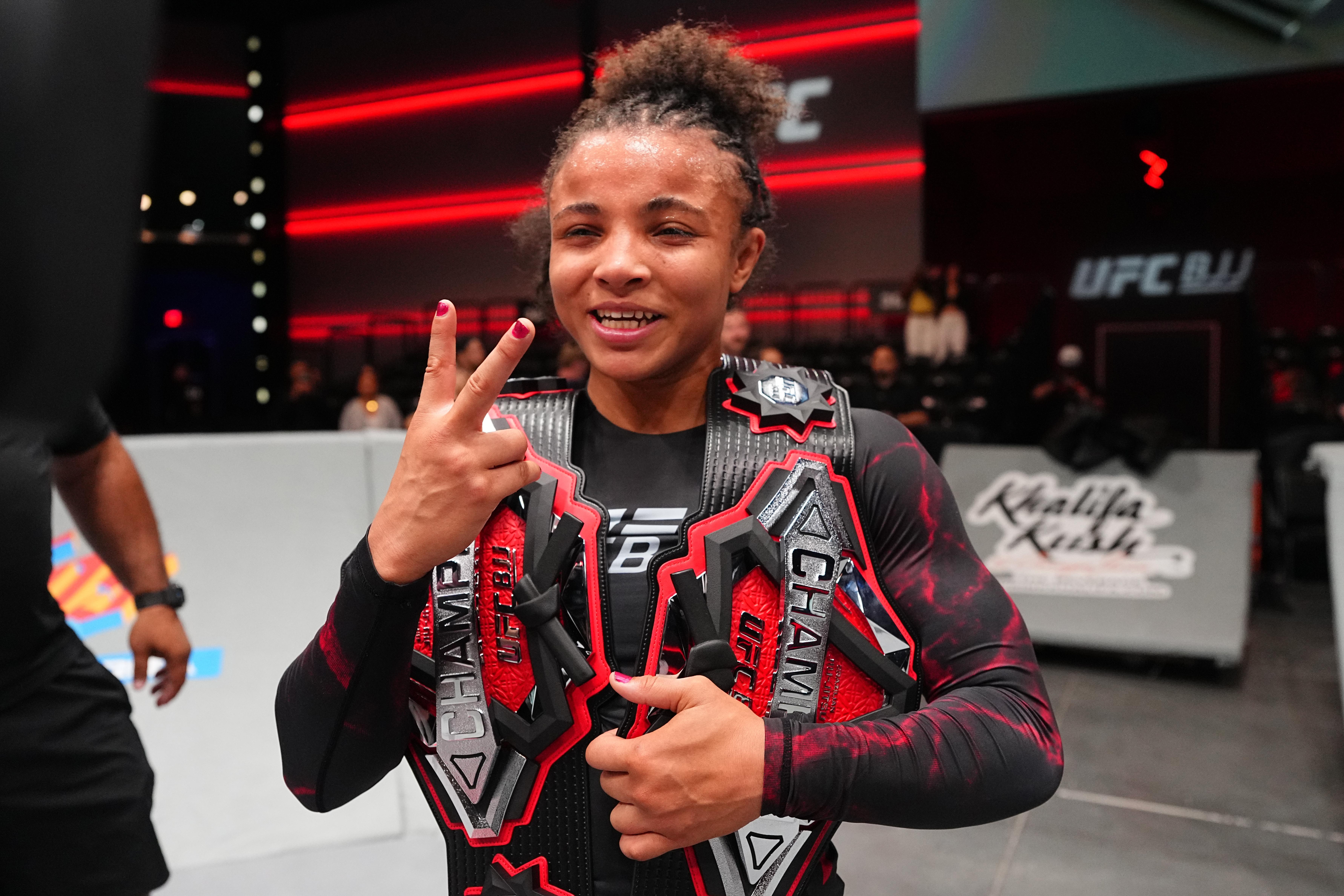 LAS VEGAS, NEVADA - OCTOBER 08: Cassia Moura of Brazil reacts after a victory against Adele Fornarino of Australia in the women's flyweight title match during the UFC BJJ 12 event at Meta APEX on October 08, 2026 in Las Vegas, Nevada.