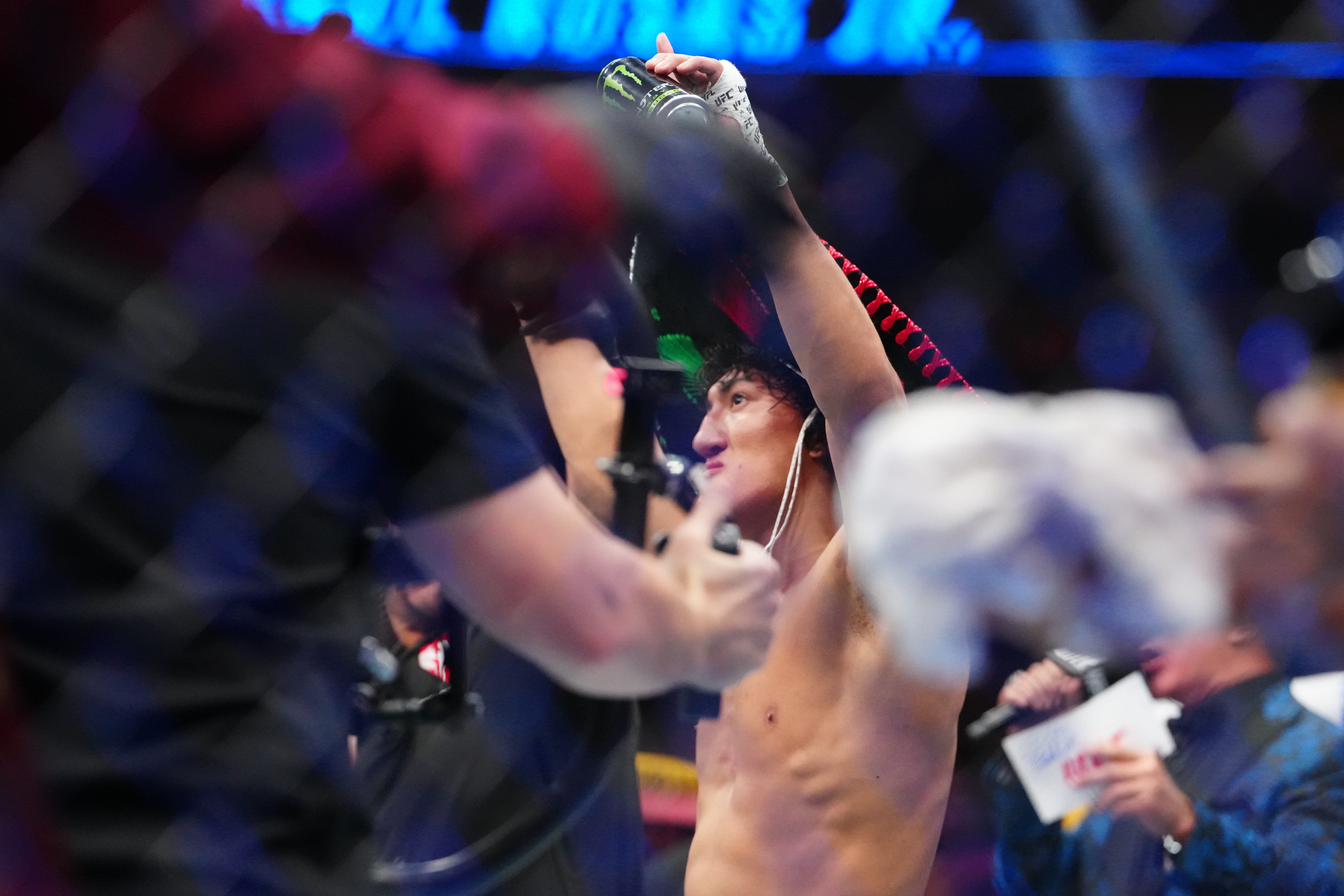 Mar 7, 2026; Las Vegas, Nevada, UNITED STATES; Raul Rosas JR (blue gloves) recasts after defeating Rob Font (red gloves) fights during UFC 326 at T-Mobile Arena. Mandatory Credit: Stephen R. Sylvanie-Imagn Images