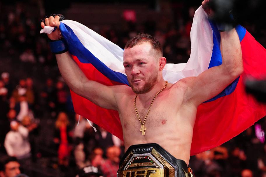 Petr Yan (blue gloves) reacts after the fight against Merab Dvalishvili (red gloves) during UFC 323 at T-Mobile Arena.