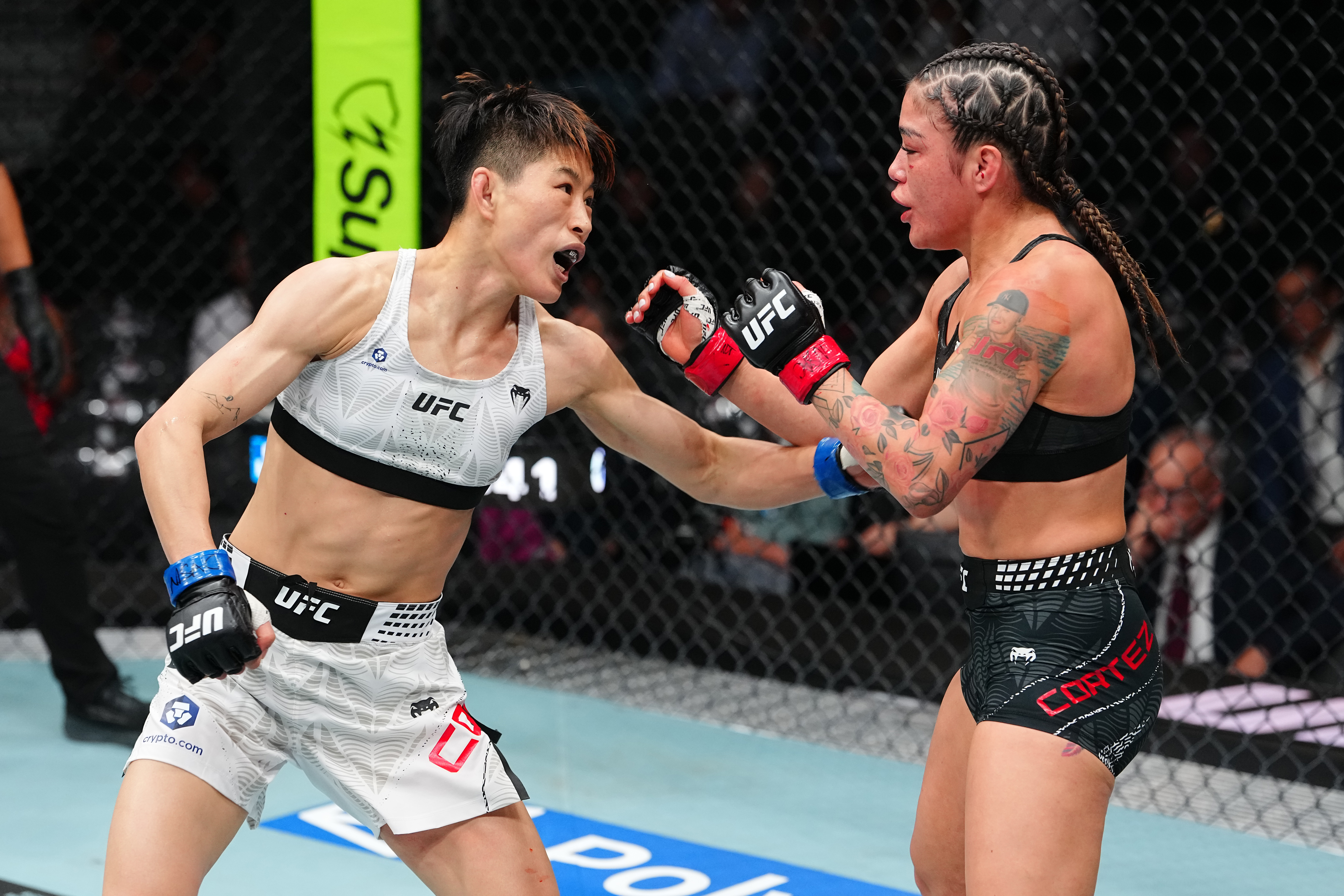 LAS VEGAS, NEVADA - JULY 11: (L-R) Wang Cong of China strikes Tracy Cortez during the UFC 329 event at T-Mobile Arena on July 11, 2026 in Las Vegas, Nevada. (Photo by Jeff Bottari/Zuffa LLC)