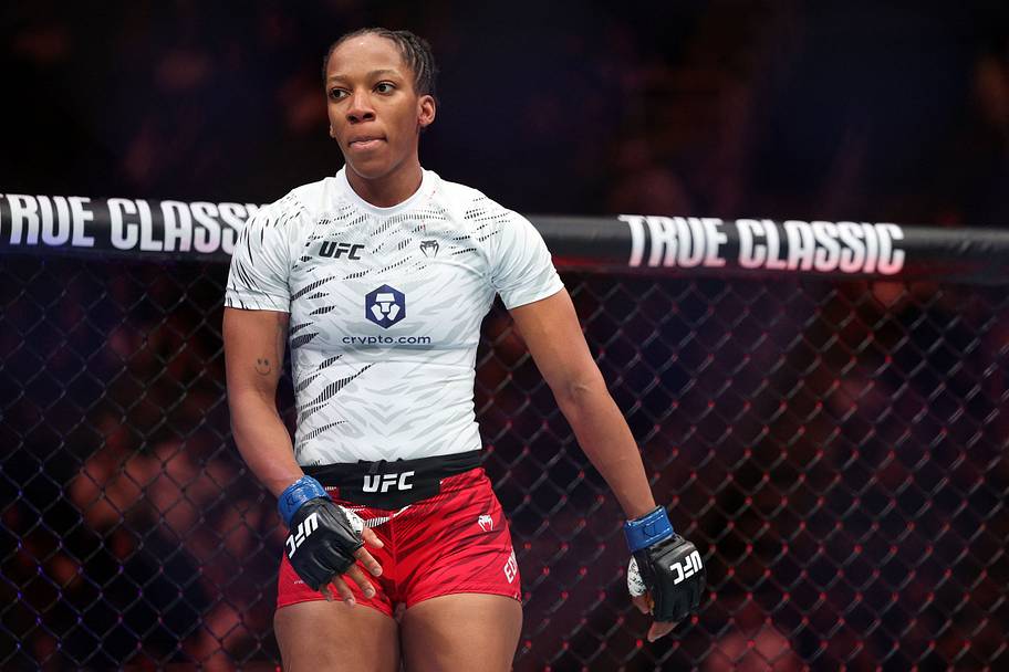 Joselyne Edwards (blue gloves) reacts after defeating Chelsea Chandler (not pictured) during UFC Fight Night at T-Mobile Cent
