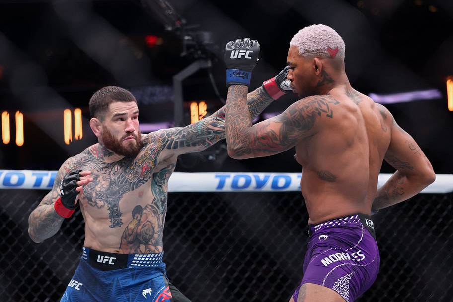 Sean Brady (red gloves) fights Michael Morales (blue gloves) in the welterweight bout during UFC 322 at Madison Square Garden