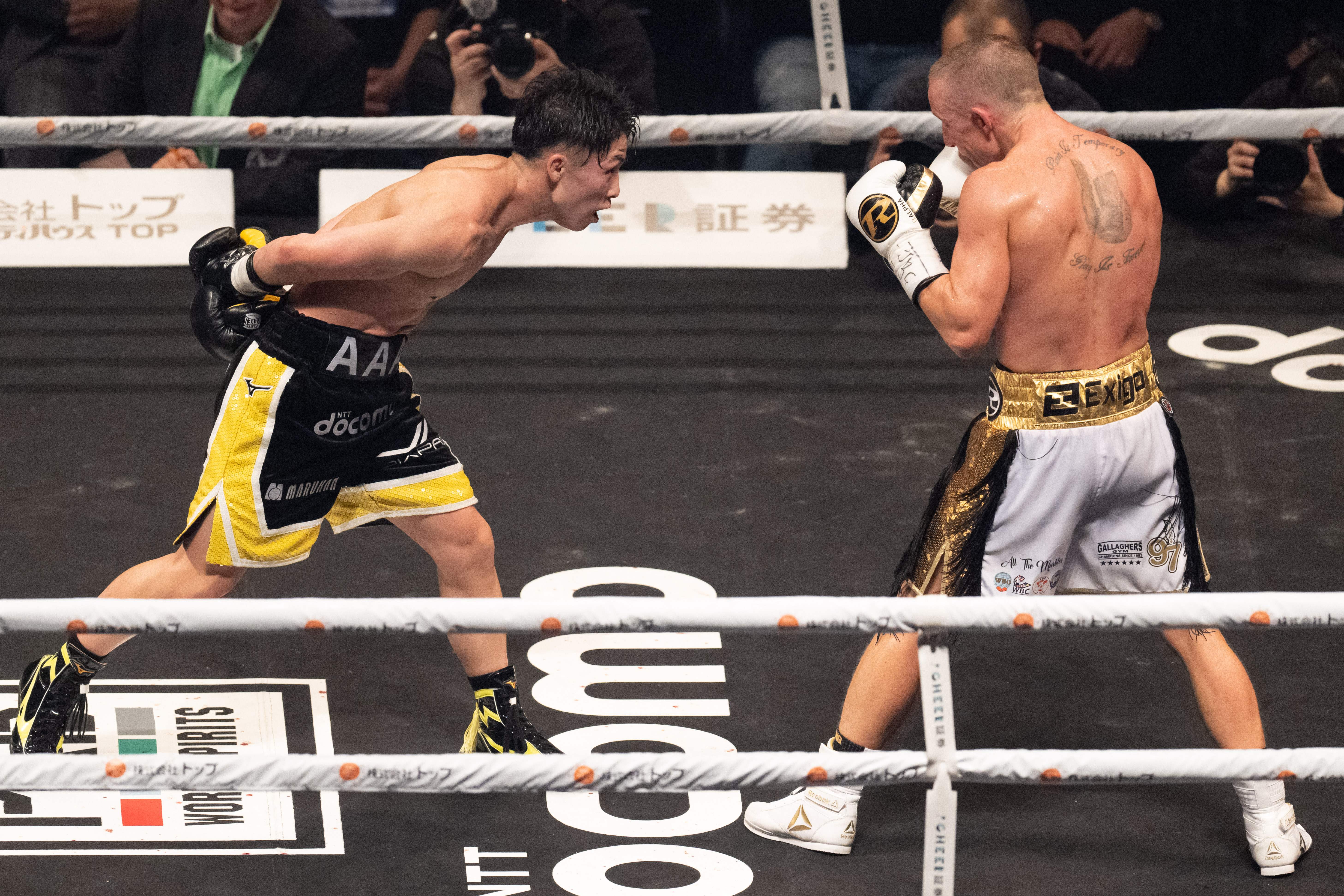 Japans Naoya Inoue (L) and Britains Paul Butler fight during their bantamweight title unification match in Tokyo on December 13, 2022. (Photo by Yuichi YAMAZAKI / AFP) (Photo by YUICHI YAMAZAKI/AFP via Getty Images)