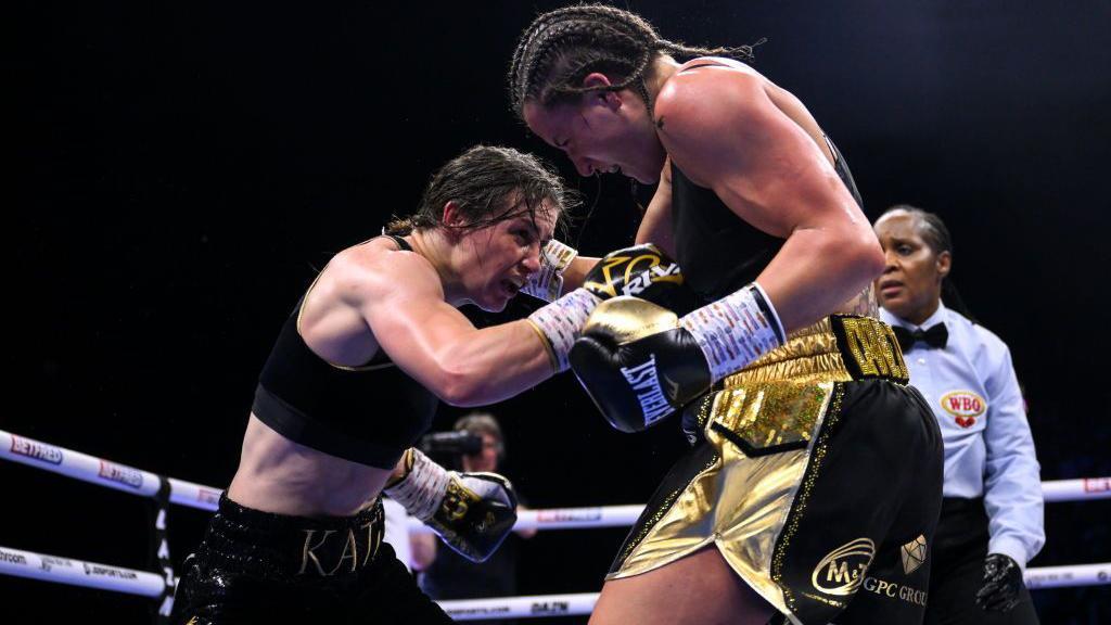 Katie Taylor is punched by Chantelle Cameron