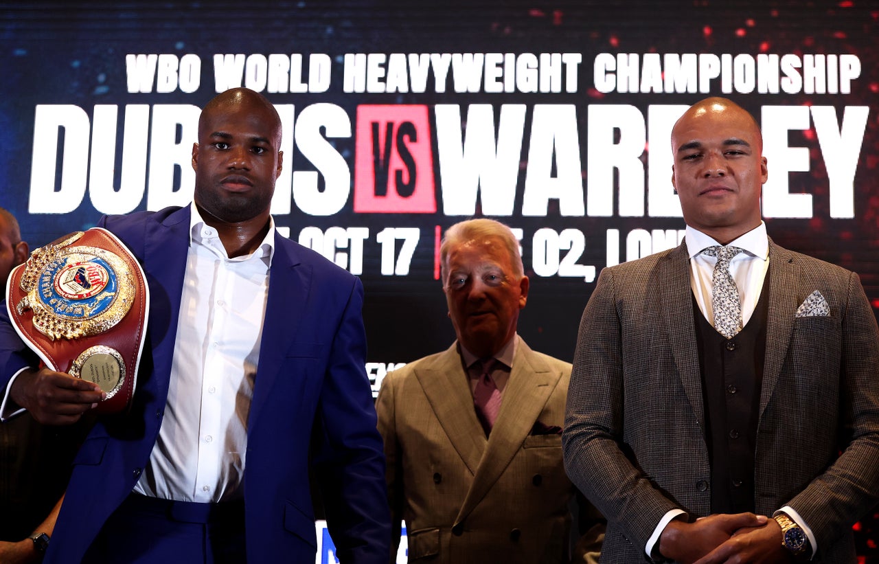 Dubois and Wardley flank promoter Frank Warren at a press conference for their rematch (Getty)